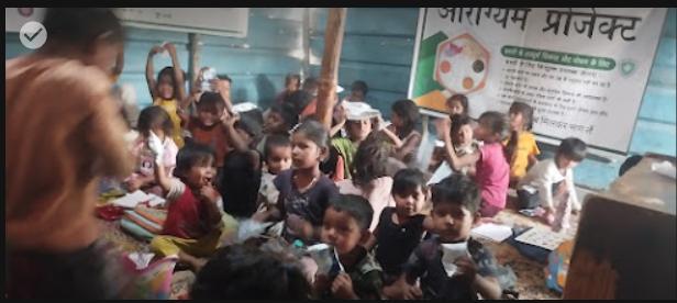 Aarogyam Project classroom with children learning in Delhi waste picker community